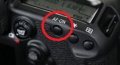 a close up of a camera with a red circle around it