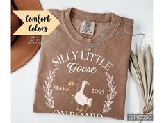 This Personalized Pregnancy Announcement Shirt is the perfect silly goose baby reveal tshirt! Our Comfort Colors tees are super soft, DTG printed (printed with ink), and 100% cotton. ❗❗There may be a slight difference in the colors due to different monitors. ❗❗ 🌞 HOW TO ORDER 🌞 * Select your size and color from the drop-down menu * Add your shirt to cart. If you would like more than one, add each one to cart individually. * Proceed to check out! * Your shirt will be ready to ship in 1-3 days! 🌞 SIZING 🌞 Check the Size Chart and Fit Guide in the photos for reference! 🌞 PRODUCTION + SHIPPING 🌞 * Order Production: 1-3 business days  * Standard Shipping: 1-5 business days after production time 🌞 SHIRT DETAILS 🌞 * 100% combed and ring-spun cotton * Relaxed fit * Soft-washed garment-dyed Baby Reveal Shirt, Pregnancy Announcement Shirt, Silly Goose, Mom To Be, Baby Reveal, Pregnancy Shirts, Comfort Colors Tee, Pregnancy Announcement, Baby Announcement