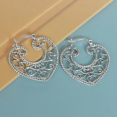 Indian style sterling silver filigree ear hoops. Dimensions: 31.5 x 33 mm weight: 5.8gm Price listed is for ONE PAIR These are made of 925 hypoallergenic sterling silver. Most of my pieces come with a 925 stamp. Can be packaged in a gift box. I can include a personal message from you if needed You are welcome to contact me at... bhavnakwintra1956@gmail.com For more beautiful pieces from my shop, please browse 👇 TOE RINGS: https://www.etsy.com/your/shops/TheSilverGame/tools/listings/section:2702 Nickel Free Small Hoop Silver Heart Earrings, Nickel-free Small Hoop Heart Earrings In Silver, Nickel Free Silver Hoop Heart Earrings, Silver Hoop Earrings With Intricate Design As Gift, Bohemian Sterling Silver Hoop Earrings For Weddings, Silver Nickel-free Hoop Heart Earrings, Nickel-free Silver Heart Hoop Earrings, Ornate Silver Hoop Earrings With Intricate Design, Silver Nickel-free Heart Hoop Earrings