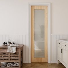 a bathroom with a sink, mirror and wooden cabinet