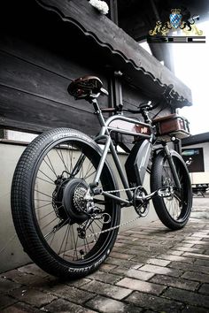 a bike parked on the side of a building