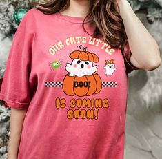 "Our cute little Pumpkin BOO Coming Soon Unisex Comfort Colors garment-dyed heavyweight t-shirt, gender reveal shirt, Pregnancy announcement tee shirt, fall Autumn baby announcement shirt. Introducing the perfect blend of style and charm, our Comfort Colors 1717 T-shirt brings forth a delightful Halloweenish design that will warm hearts and raise spirits. Celebrate the joyous anticipation of your little one's arrival with this endearing baby announcement and gender reveal tee, lovingly adorned w Cute Soft-washed Pink T-shirt, Funny Pink T-shirt For Gender Reveal, Cute T-shirt With Funny Print For Gender Reveal, Cute Funny Print T-shirt For Gender Reveal, Cute Crew Neck T-shirt For Gender Reveal, Pumpkin Boo, Expecting Mother Gifts, Boo Pumpkin, Baby Announcement Shirts