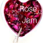 a heart - shaped bowl filled with jelly and the words rose jam