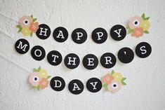 a happy mother's day banner with flowers on it