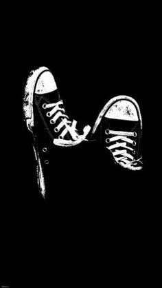 a black and white drawing of a pair of shoes with laces on the bottom