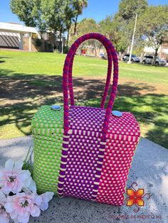 Fashionable, beautiful and durable bag, very practical and spacious. Beautiful bag made with recycled plastic hand-woven by Mexican artisans, 100% Handmade in Mexico. Closes at the top with a magnetic closure, Braided plastic top handles. -Washable -Original designs MEASUREMENTS: LENGTH: 10 INCHES WIDTH: 6 INCHES HIGH: 8 INCHES THE BAG IS SOLD WITHOUT ACCESSORIES Accessories for your bag: https://www.etsy.com/mx/listing/1336193240 https://www.etsy.com/mx/listing/1336163670 https://www.etsy.com/mx/listing/948494865 https://www.etsy.com/mx/listing/1336124646 Eco-friendly Rectangular Reusable Lunch Bag, Multicolor Rectangular Bag For Picnic, Multicolor Basket Bag As Gift, Multicolor Basket Bag As A Gift, Multicolor Basket Bag For Gift, Eco-friendly Rectangular Shoulder Bag For Picnics, Eco-friendly Rectangular Shoulder Bag For Picnic, Eco-friendly Handwoven Bag For Picnic, Green Box Bag Gift