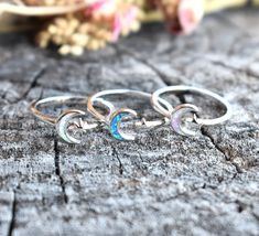 "Opal Moon & Star Ring: -Solid .925 sterling silver -Face height 8mm on 2mm width ring band -Color choice Pink or blue opal with 5 point star, or white opal with North star. -Comfortable and easily stackable! -Available in US sizes 3-13 with half sizes.  More rings here: https://www.etsy.com/shop/AWildViolet?ref=seller-platform-mcnav&section_id=13958646 Looking for a last minute or unique Christmas gift? Visit our \"READY TO SHIP\" section here, ships out in one business day https://www.etsy.com Celestial Crescent Moonstone Ring, Celestial Style White Gold Rings, Adjustable Celestial Star-shaped Rings, Celestial Sterling Silver Moonstone Open Ring, Mystical Silver Rings With Moon Phase, Sterling Silver Crescent Moonstone Promise Ring, Silver Crescent Moonstone Ring In Celestial Style, Silver Celestial Moonstone Ring, Celestial Silver Moonstone Ring With Sun And Moon Design