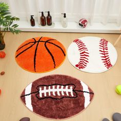 three rugs with different sports balls on them