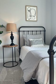 Gunmetal gray twin metal bed frame with a side table and lamp. White Bedroom Minimal, Twin Metal Bed, Black Iron Beds, Minimal Bedroom, Iron Bed Frame, Twin Bed Frame, Iron Bed, Metal Bed, Metal Beds