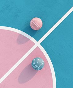 an overhead view of two basketballs and a ball on a blue, pink and white court