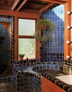 a bath room with a sink and a tub next to a window on the wall