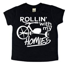 Rollin' With My Homies All shirts are very soft, lightweight. Tees run True to Size with a slimmer cut. 60% cotton 40% polyester May shrink slightly when washed. Machine wash cold water, No bleach, Tumble dry low (with shirt inside out). Graphic size and placement can vary depending on the garment size. Ink variation/color may vary slightly. Kids tees and Adult tees are not an exact color match. All sales are final. No refunds or exchanges. My Homies, Kids Clothing Brands, Toddler Boy Fashion, Fun Sweatshirts, Small Shops, Simple Shirts