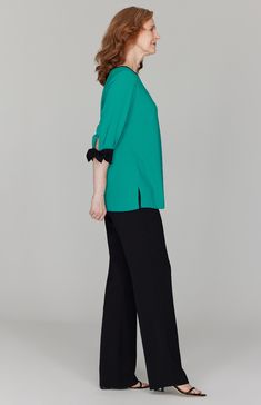 A perfectly simple blouse with beautiful tie cuffs. Always trimmed in black so it pairs easily with your favorite black pant. Featuring ¾ sleeves and a back neckline keyhole. Elegant 3/4 Sleeve Workwear Blouse, Elegant 3/4 Sleeve Blouse For Work, Elegant Formal Blouse With 3/4 Sleeves, Chic Blouse With 3/4 Roll-up Sleeves, Chic Blouse With Roll-up 3/4 Sleeves, Chic 3/4 Sleeve Blouse For Work, Elegant 3/4 Sleeve Blouse With Button Cuffs, Elegant Blouse With 3/4 Sleeves And Button Cuffs, Chic 3/4 Sleeve Blouse With Button Cuffs