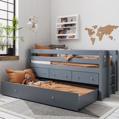 a child's bedroom with bunk beds and dressers