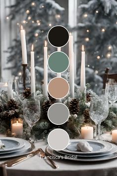 the table is set with candles, plates and place settings for an elegant christmas dinner