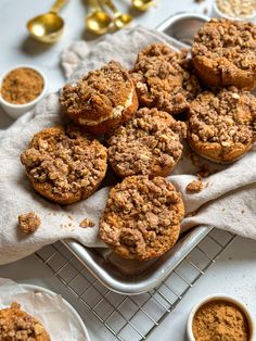 several muffins are on a cooling rack