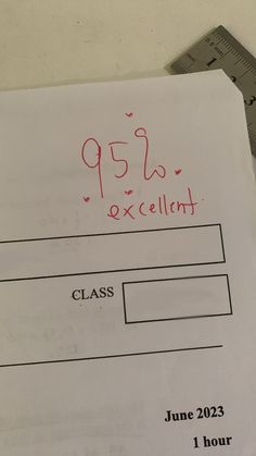 a piece of paper with the words class written on it next to a calculator