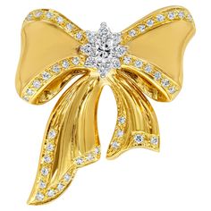 A beautiful piece of jewelry showcasing a ribbon / bow tie design made in 18k yellow gold, accented by brilliant diamonds on the center, and edges of the design. Diamonds weigh 1.01 carats total and are approximately G-H color, SI clarity. Tie Brooch, Bow Tie Design, Ribbon Bow Tie, Diamond Ribbon, Gold Tie, Jewelry Showcases, Tie Design, Bow Jewelry, Ribbon Bow