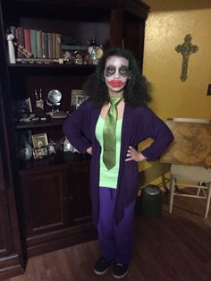 a woman dressed as the joker posing for a photo