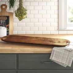 a loaf of bread sitting on top of a wooden counter