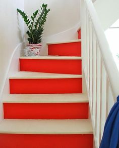 the stairs are painted bright red and white