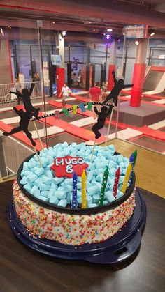 a birthday cake with candles and decorations on it