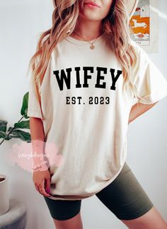 "WIFEY Shirt, Comfort colors® t-shirt, Est. Shirt, Wife Shirt, Bride Shirt, Gift For Bride, Wifey EST Shirt, Just Married, Wife,Engagement Gift Perfect wedding gift, or newlywed gift for new husband & wife, Honeymoon Shirts or Wedding announcement gift.  Text will be in white or black 📋 HOW TO ORDER: 1. Select the size 2. Select the color 3. Select the quantity (NOT SOLD AS A SET) 4. Add personalization if required 5.Add to Cart (\"buy now\" will take you directly to checkout and \"add to cart\ Funny Wife Shirts, Wifey Shirt, Italy Shirt, Engaged Shirts, Anniversary Shirt