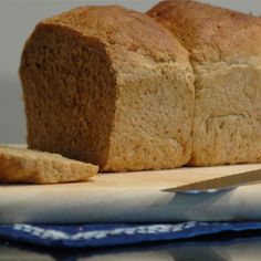 a loaf of bread sitting on top of a cutting board