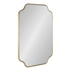 a gold framed mirror with an ornate frame on the front and bottom, against a white background