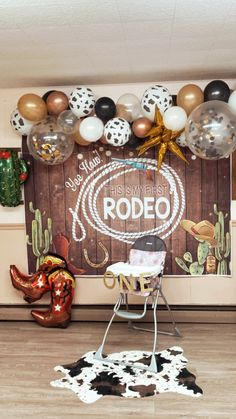 the rodeo themed party is set up with balloons and decorations