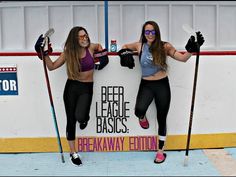 two women are posing in front of a sign for the beer league basics breakaway edition