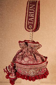 Buy Maroon Glass Beads Floral Thread And Sequin Embroidered Potli Bag by Tarun Tahiliani Online at Aza Fashions. Elegant Multicolor Embroidered Potli Bag For Festivals, Traditional Shoulder Bag With Handwork For Receptions, Elegant Multicolor Embroidered Bags For Festivals, Luxury Bags With Intricate Embroidery For Reception, Luxury Festive Bags With Intricate Embroidery, Red Festive Bags For Reception, Festive Red Bags For Reception, Traditional Potli Pouch Bag For Reception, Traditional Bags With Resham Embroidery