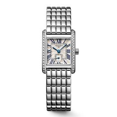 With its discreet profile and classic styling, the Longines Mini DolceVita is a small but mighty masterpiece that exquisitely expresses, in equal part, Longines' quiet luxury and contemporary elegance. This timepiece boasts a 21.50 x 29.00mm stainless steel case and a silver "flinque" dial with painted Roman numerals and blued steel hands. This model dazzles with a case framed by 38 IF-VVS Top Wesselton diamonds. And a Roman rectangular silver-colored dial inside the case calls attenti Diamond Bezel Bracelet, Bezel Bracelet, Longines Watch, Kate Winslet, Quiet Luxury, Bezel Diamond, Jennifer Lawrence, Stainless Steel Watch, Watch Case