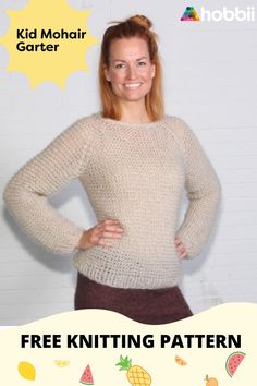 a woman standing with her hands on her hips wearing a knit sweater and brown skirt