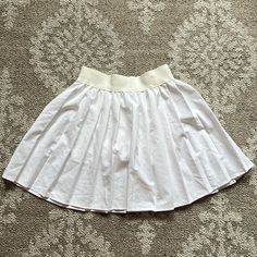 High Waisted White Workout Tennis Skirt With Pleats. Never Worn, Very Comfy, Stretchy And Has Athletic Shorts Built In Cotton Lined Mini Skirt For Daywear, Fitted Elastic Waistband Pleated Mini Skirt, Fitted Mini Pleated Skirt With Elastic Waistband, Fitted Pleated Mini Skirt With Elastic Waistband, Stretch Cotton Skort, Solid Stretch Skirt For Daywear, Fitted Cotton Skort For Daywear, Stretch Cotton Skort With Lined Skirt, Stretch Cotton Skirt For Day Out