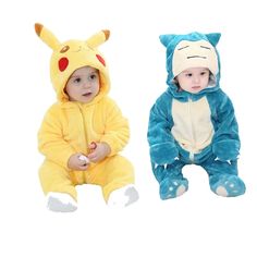 two babies dressed in pokemon onesuits sitting next to each other on a white background