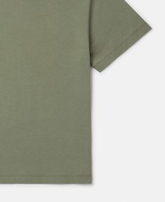 Basic Green Tops With Logo Print, Green Basic Top With Logo Print, Solid Cotton Tops With Logo Print, Solid Cotton Top With Logo Print, Modern Green Short Sleeve Top, Green Organic Cotton Tops With Graphic Print, Green Graphic Print Organic Cotton Tops, Green Organic Cotton Top With Graphic Print, Green Graphic Print Tops In Organic Cotton