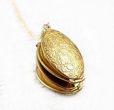 ♥Gold colored oval folding locket with floral motif that holds four photos ♥ Such a unique jewelry gift and the perfect gift for you or a loved one ♥Great for wedding photos, family photos, family album, new baby, memory photos, wedding bouquet locket and more! W H Y ∙ Y O U ' L L ∙ L O V E ∙ I T * It's a unique gift that holds special photos * A keepsake piece you will treasure * High quality materials and attention to detail G O L D ∙ L O C K E T * Material: Sturdy brass locket * Locket Dimens Elegant Oval Locket Necklace For Anniversary, Oval Locket Necklaces For Anniversary, Elegant Oval Locket Necklace For Anniversary Gift, Oval Locket Jewelry For Anniversary Gift, Oval Locket Necklace For Anniversary Gift, Antique Gold Oval Locket Necklace For Keepsake, Victorian Oval Locket Necklace As Gift, Victorian Oval Locket Necklace Gift, Antique Gold Oval Locket Necklace For Gift