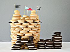 a stack of cookies sitting on top of each other with flags sticking out of them