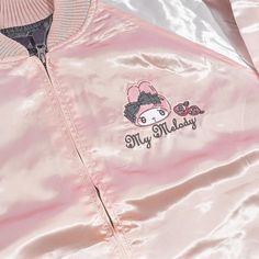 This super cute jacket is inspired by the iconic “sukajan” or the Japanese baseball varsity jacket that’s known for its large back design! Wear this shiny pink and white bomber jacket to keep you warm when it’s rainy! It has long sleeves, a small My Melody embroidery at the front, and a bigger version at the back! Made from 100% satin-like polyester Comes with a zipper closure and side pockets Width: 58 cm Length: 67 cm Sleeve length: 85 cm Pink Harajuku Outerwear For Spring, Harajuku Pink Outerwear For Spring, Pink Harajuku Style Outerwear For Spring, Trendy Pink Varsity Jacket For Streetwear, Pink Spring Varsity Jacket For Streetwear, Pink Long Sleeve Varsity Jacket For Streetwear, Pink Varsity Jacket For Spring Streetwear, Pink Winter Varsity Jacket, Pink Long Sleeve Varsity Jacket For Winter