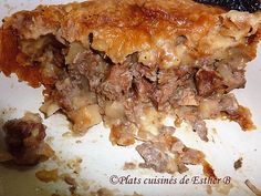 a piece of meat and cheese pie on a white plate with a black serving utensil