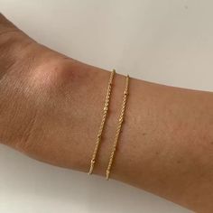 Minimal and dainty double chain wrap bracelet, perfect for layering with other bracelets or worn alone. The metal beads give off a subtle sparkle that is perfect for every occasion. Gold Vermeil (Thick layer of Gold plated over Sterling Silver) Sizes: 6in(15.2cm), 6.75in(17cm) and 7.5in(19cm) Quality Italian Chain Width: 1mm Handcrafted in NYC Hypoallergenic, lead and nickel free #B043 Simple Adjustable Gold Bracelet With Delicate Chain, Gold Ball Chain Bracelet For Everyday, Everyday Tiny Beads Chain Bracelet, Adjustable Gold Bracelet With Satellite Chain, Gold Bracelets With Tiny Beads For Layering, Adjustable Double Strand Dainty Bracelet, Dainty Adjustable Chain Bracelet, Minimalist Delicate Chain Bracelet For Layering, Delicate Chain Bracelet For Layering