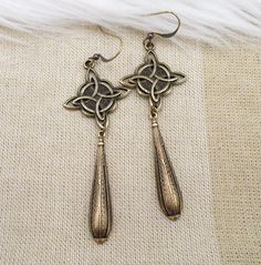 Bronze Celtic Knot Metal Earring, Dark Antiqued Brass Long Statement Earring, Viking Aesthetic, Ren Faire Jewelry, Unique Gift For Friend Antique Gold Drop Earrings With Antique Finish, Bronze Antique Finish Drop Earrings, Antique Gold Metal Earrings With Antique Finish, Bronze Antique Finish Dangle Earrings, Bronze Long Drop Metal Earrings, Bronze Brass Long Drop Earrings, Viking Aesthetic, Long Statement Earrings, Celtic Knots