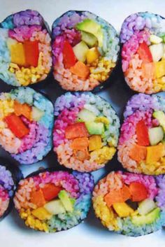 rainbow sushi rolls with dipping sauce on the side