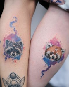 two raccoon tattoos on both legs with watercolor splashes and skulls in the background