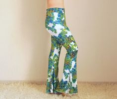 "Green floral bell bottoms women Boho adorable stretchy so comfortable women bell bottoms. You can wear this floral cute leggings for the Festival,Activity,Party,Also you can wear to go to Clubs etc... If you would like to feel the 70s clothing style this stretchy unique bell bottoms is just for you. Choose your size.This floral boho bell bottoms made by stretchy jersey and avaliable plus size XXL.. SIZE CHART; Extra Small (US 0-2) (AU 6 ) (UK 6) Waist: 26\" In seam:31\" Out seam:46\" Leg openin Spring Flared Yoga Pants, Spring Yoga Pants, Wide-leg, Wide-leg Yoga Pants For Spring, Spring Yoga Wide-leg Pants, Spring Wide-leg Yoga Pants, Hippie Flare Stretch Pants, Green Non-stretch Pants For Vacation, Bohemian High-waisted Wide Leg Pants With Floral Print, Green Bohemian Bottoms With Floral Print