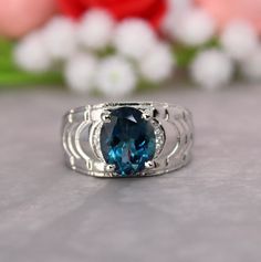 Presenting you A Beautiful London Blue Topaz Ring InBohemian Style with Four Prong Setting in Oval Shape, accompanied with zircons. The Ring has Smooth Edges. Perfect for multiples occasions. The Deep Blue Color with strong luster is Really a Query maker. Designed for both men and women. Perfect gift for your mom or dad. Item No: skj.42.827 Item: London Blue Topaz Ring in 925 Sterling Silver Primary Stone: London Blue Topaz Secondary Stone: zircons Article Weight: 7.9 gms primary stone Size: 9x11 mm Ring Length: 1.2 cm Ring Width: 2.1 cm Maintenance Tips 1. Keep the jewelry away from direct heat, water, perfumes, deodorants, and other strong chemicals.  2. Wipe the Jewellery gently with a chamois cloth or leather swatch after every use.  3. Wiping the jewelry with a soft cloth after removi London Topaz Ring, Topas Ring, London Topaz, Beautiful London, Gift For Love, Blue Topaz Gemstone, London Blue Topaz Ring, Silver Anniversary, Bohemian Rings