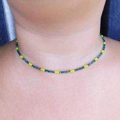 Beautiful shiny choker necklace with green and yellow crystal beads. This beautiful necklace made from 1mm green and yellow crystal beads, and closes with a stainless steel clasp and a stainless steel adjustable chain (2inches). SIZE This necklace is available in 2 different sizes: (14inch-16inch) - (6inch-18inch). Please contact with me if you prefer a different size. Every item we sell is handmade and handcrafted with love and care. All PolysJewelryArt jewelry arrived in a beautiful box or pou Adjustable Green Choker With Tiny Beads, Green Beaded Choker Jewelry, Green Choker With Tiny Round Beads, Green Tiny Beads Choker Necklace, Adjustable Green Crystal Necklace With Beaded Chain, Adjustable Yellow Choker With Tiny Beads, Yellow Tiny Beads Choker For Gift, Yellow Tiny Beads Choker As Gift, Green Minimalist Beaded Necklace With Tiny Beads