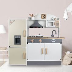 a child's play kitchen set in white and grey