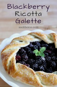 blackberry ricotta galette on a white plate with text overlay that reads blackberry ricotta galette